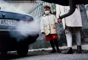 Photo by Science Photo Library on Canva.com - Child by roadside wearing air pollution face mask